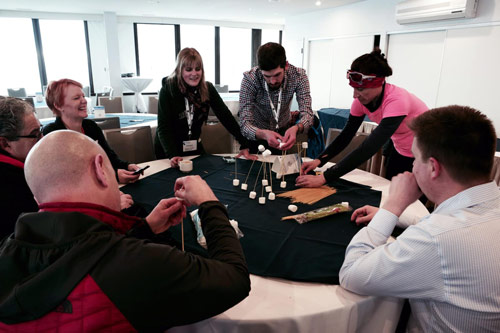 Participants during a team building experience from Learn2 and led by a certified trainer